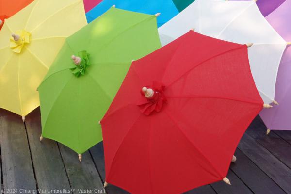 Fabric bamboo umbrellas in colorful row