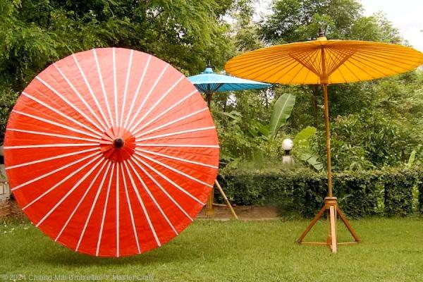 Chiang Mai Classic Bamboo Patio umbrellas, painted white stripes on red, colors yellow, sky blue