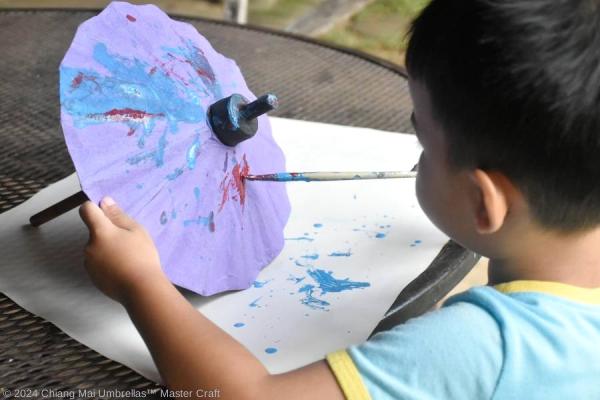 Paper umbrella DIY art painting on color violet